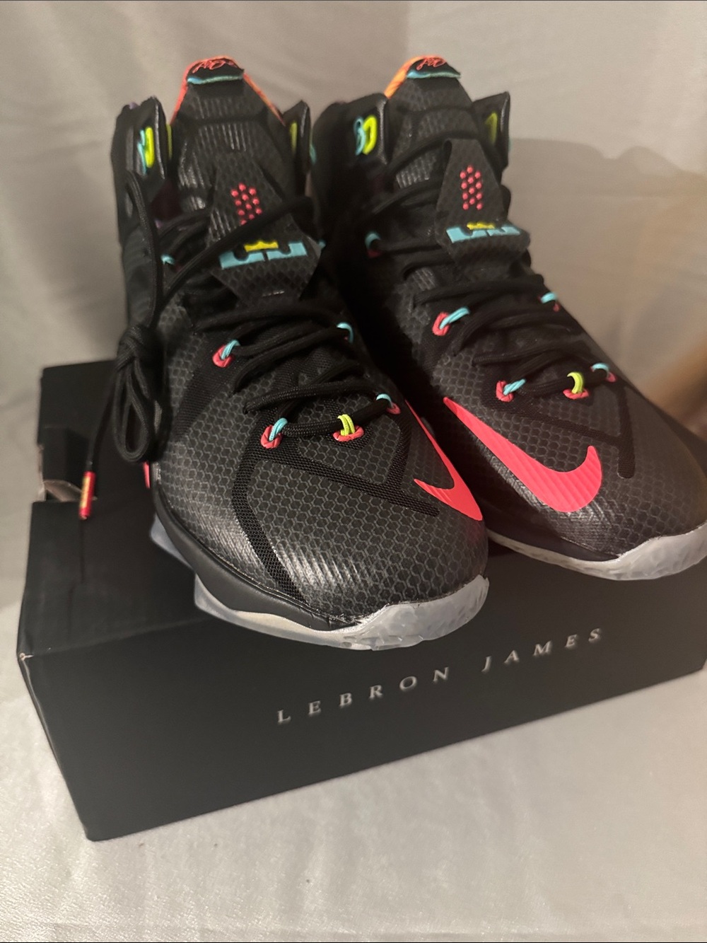 New! Nike LeBron 12 'Data' features a black upper with mango and volt accents.